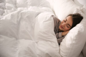 a woman sleeping in a allergen free bed